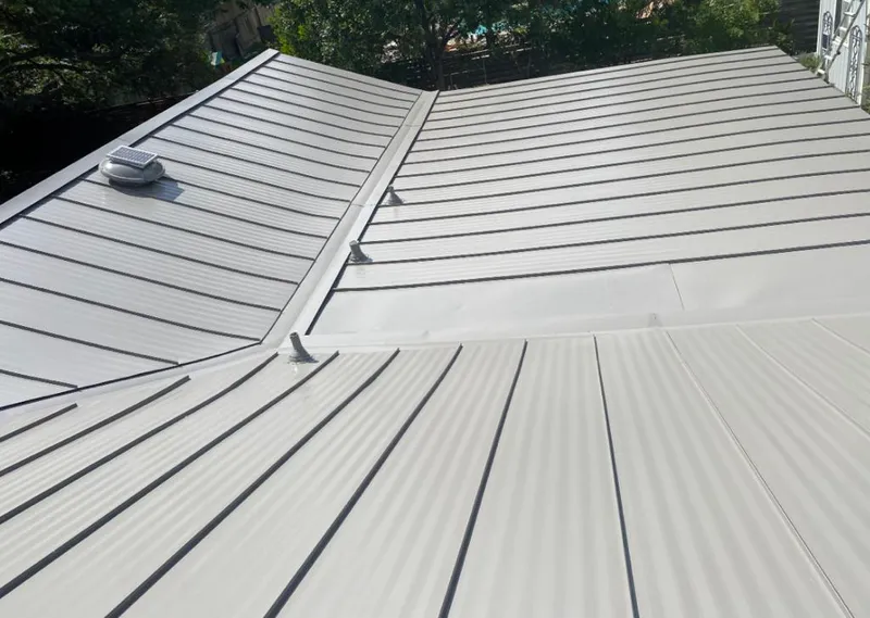 Solar attic fan installed on a metal roof for Roof Ventilation in West Whittier-Los Nietos